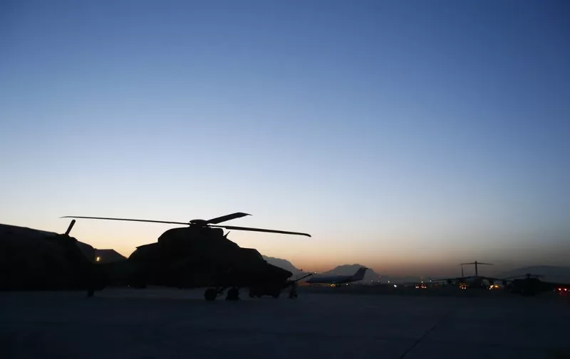 A French army Eurocopter EC 665 Tigre helicopter of the 5eme Regiment d'Helicopteres de Combat (5th Combat Helicopter Battalion) is seen at sunrise, at the French Helicopter Battalion "Mousquetaire" at the Kabul International airport, in Kabul, on August 19, 2012. France is the fifth largest contributor to NATO's International Security Assistance Force (ISAF), which is due to pull out the vast majority of its 130,000 troops by the end of 2014. AFP PHOTO / ALEXANDER KLEIN (Photo by ALEXANDER KLEIN / AFP)