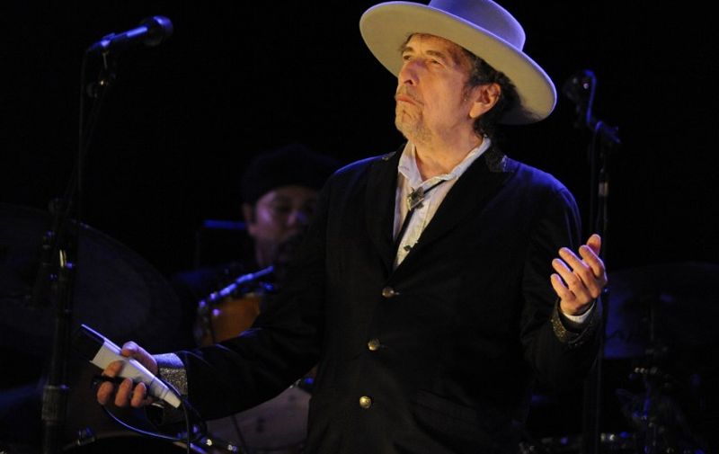 US legend Bob Dylan performs on stage during the 21st edition of the Vieilles Charrues music festival on July 22, 2012 in Carhaix-Plouguer, western France.  AFP PHOTO / FRED TANNEAU / AFP PHOTO / FRED TANNEAU