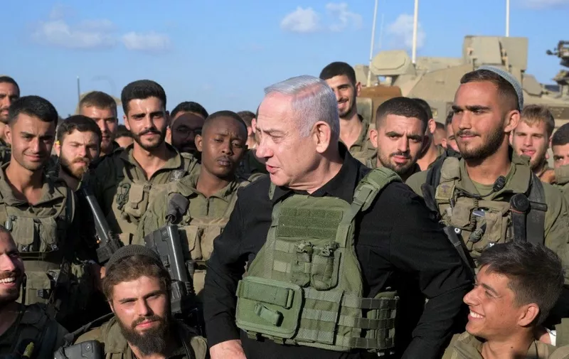 JERUSALEM - OCTOBER 18: (----EDITORIAL USE ONLY – MANDATORY CREDIT - 'AVI OHAYON / GPO / HANDOUT' - NO MARKETING NO ADVERTISING CAMPAIGNS - DISTRIBUTED AS A SERVICE TO CLIENTS----) Prime Minister Benjamin Netanyahu meets with soldiers stationed near the Gaza Strip in Jerusalem on October 18, 2023. Avi Ohayon (GPO) / Anadolu (Photo by Avi Ohayon (GPO) / ANADOLU / Anadolu via AFP)