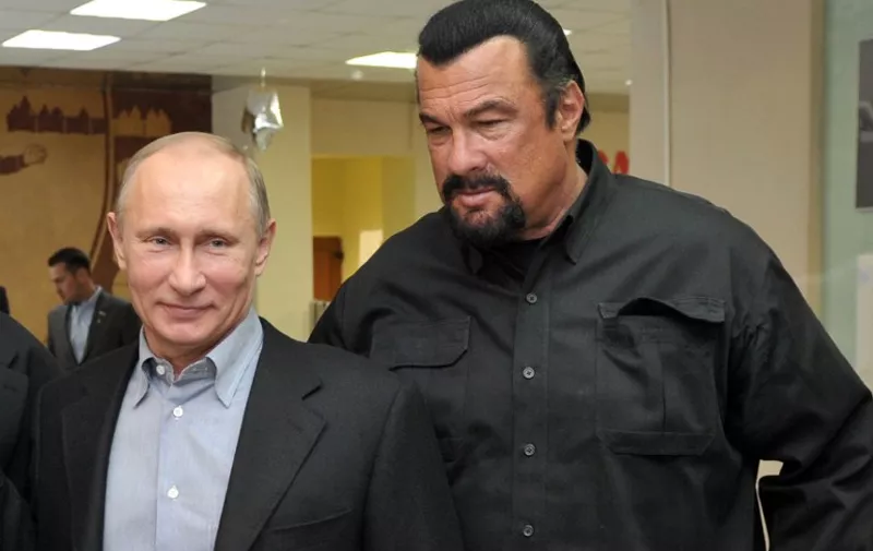 (FILES) This photo taken on March 13, 2013 shows Russia's President Vladimir Putin and American action movie actor Steven Seagal visiting a newly-built sports complex of Sambo-70 prominent wrestling school in Moscow. Hollywood tough guy Steven Seagal has had his blues gig cancelled at a festival in Estonia following an uproar in this formerly-Soviet ruled Baltic state over the star's pro-Russia views, the authorities said on July 29, 2014. AFP PHOTO/ RIA-NOVOSTI/ POOL / ALEXEI NIKOLSKY