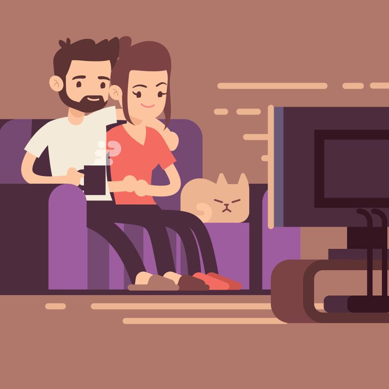 Relaxed happy young couple watching tv at home in living room. Couple woman and man on sofa with cat, illustration of young couple watch tv