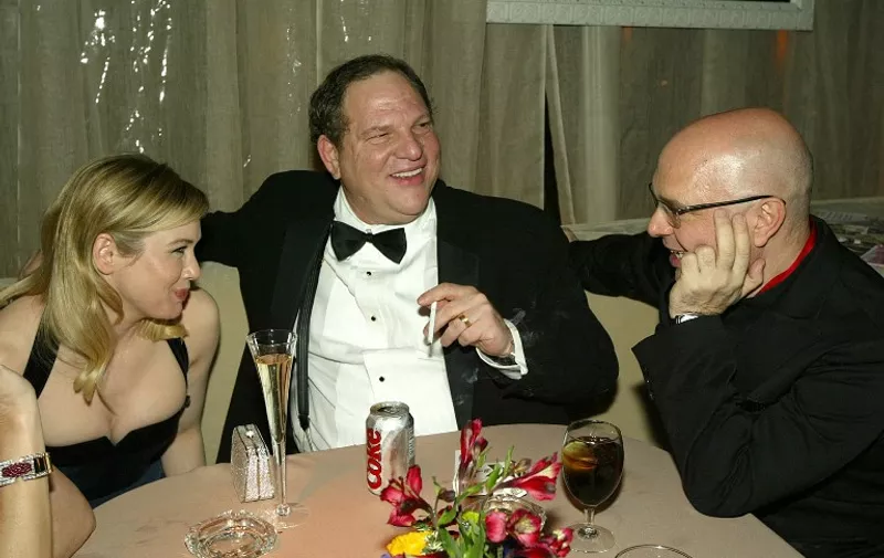 BEVERLY HILLS, CA - JANUARY 25:  Actress Rene Zellweger(L), Harvey Weinstein and director Anthony Minghella attend the Miramax Golden Globes After-Party at Trader Vics on January 25, 2004 in Beverly Hills, California. (Photo by Kevin Winter/Getty Images) *** Local Caption *** Rene Zellweger;Harvey Weinstein;Anthony Minghella