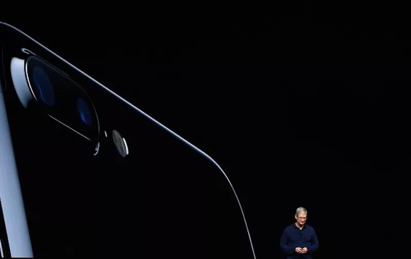 Apple CEO Tim Cook introduces the new iPhone 7 during an event inside Bill Graham Civic Auditorium in San Francisco, California on September 07, 2016.   / AFP PHOTO / Josh Edelson