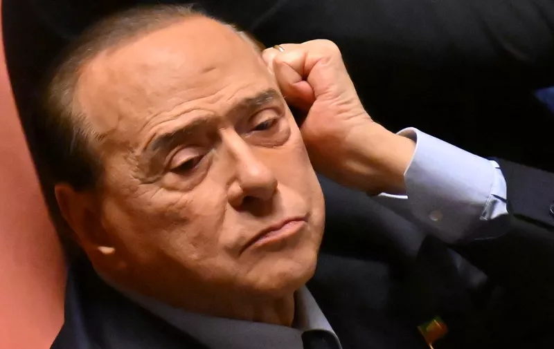 (FILES) In this file photo taken on October 26, 2022 Italys Forza Italia party leader Senator Silvio Berlusconi looks on at The Senate, ahead of a confidence vote for Italy's new Prime Minister Giorgia Meloni at Madama Palace (Palazzo Madama) in Rome on October 26, 2022. - Former Italian Prime Minister Silvio Berlusconi was in intensive care on Wednesday for heart problems, a member of his entourage told AFP. (Photo by Alberto PIZZOLI / AFP)
