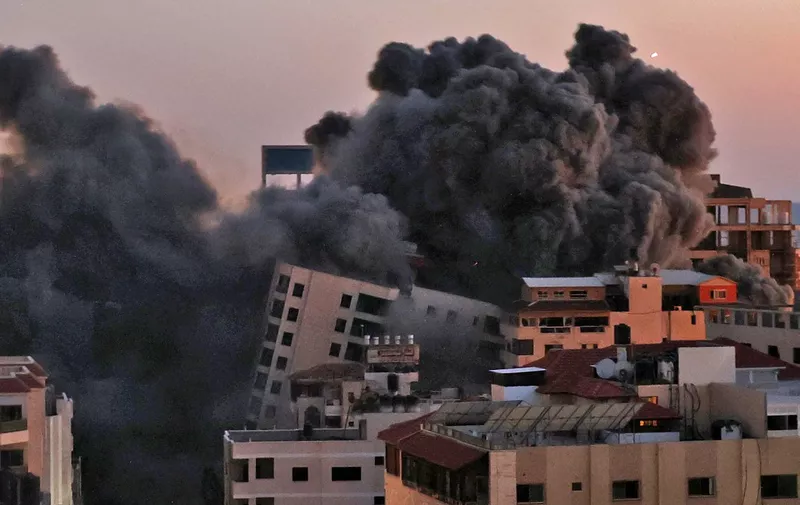 Smoke billows from an Israeli air strike on the Hanadi compound in Gaza City, controlled by the Palestinian Hamas movement, on May 11, 2021. (Photo by MOHAMMED ABED / AFP)