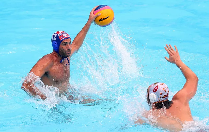 GWANGJU, SOUTH KOREA - JULY 25: Javier Garcia Gadea #12 of Croatia 
looks for a pass against Roger Tahull I Compte #9 of Spain during the Men's Water Polo Semifinal match on day thirteen of the Gwangju 2019 FINA World Championships at Nambu University on July 25, 2019 in Gwangju, South Korea. (Photo by Catherine Ivill/Getty Images)