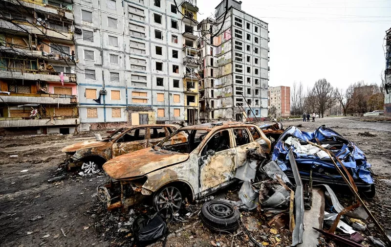 ZAPORIZHZHIA, UKRAINE - NOVEMBER 22, 2022 - Crashed cars are left outside an apartment building destroyed in the shelling of Russian troops, Zaporizhzhia, southeastern Ukraine. The emergency liquidation and rescue unit of Ukraine's State Emergency Service that had been created during Russia's full-scale invasion was involved in the removal of the rubble from the residential building.NO USE RUSSIA. NO USE BELARUS. (Photo by Dmytro Smolienko / NurPhoto / NurPhoto via AFP)