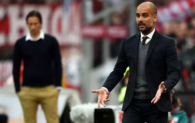 Bayern Munich's Spanish head coach Pep Guardiola reacts during the German first division Bundesliga football match between Bayer 04 Leverkusen and FC Bayern Munich at the BayArena in Leverkusen, western Germany, on May 2, 2015.  AFP PHOTO / PATRIK STOLLARZ

RESTRICTIONS - DFL RULES TO LIMIT THE ONLINE USAGE DURING MATCH TIME TO 15 PICTURES PER MATCH. IMAGE SEQUENCES TO SIMULATE VIDEO IS NOT ALLOWED AT ANY TIME. FOR FURTHER QUERIES PLEASE CONTACT DFL DIRECTLY AT + 49 69 650050.