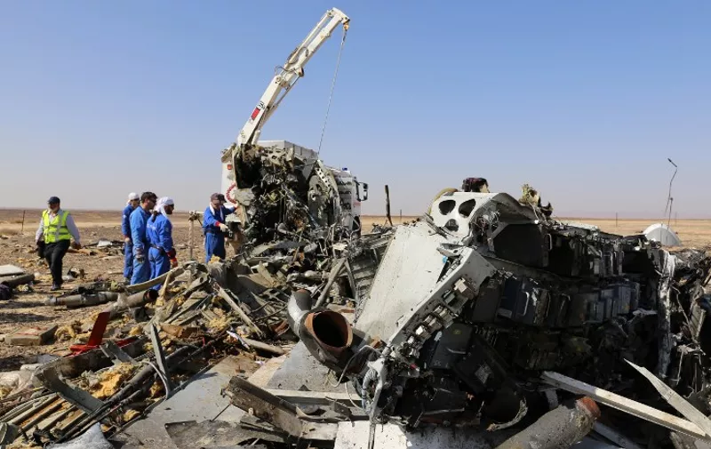 A handout picture taken on November 2, 2015 and released on November 3, 2015 by Russia's Emergency Ministry shows Russian emergency services personnel working at the crash site of a A321 Russian airliner in Wadi al-Zolomat, a mountainous area of Egypt's Sinai Peninsula. Russian airline Kogalymavia's flight 9268 crashed en route from Sharm el-Sheikh to Saint Petersburg on October 31, killing all 224 people on board, the vast majority of them Russian tourists. AFP PHOTO / RUSSIA'S EMERGENCY MINISTRY
*RESTRICTED TO EDITORIAL USE - MANDATORY CREDIT "AFP PHOTO / RUSSIA'S EMERGENCY MINISTRY" - NO MARKETING NO ADVERTISING CAMPAIGNS - DISTRIBUTED AS A SERVICE TO CLIENTS *