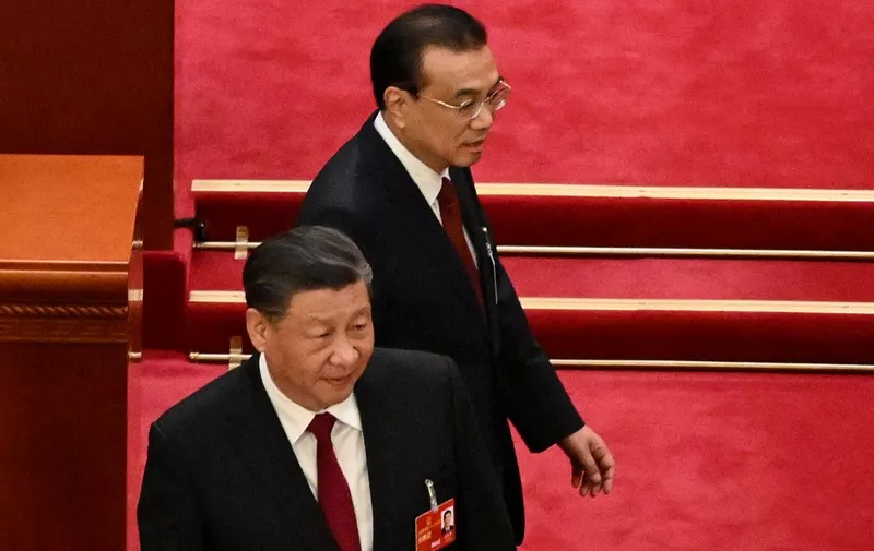China's President Xi Jinping (L) and Premier Li Keqiang arrive for the opening session of the National People's Congress (NPC) at the Great Hall of the People in Beijing on March 5, 2023. (Photo by NOEL CELIS / AFP)