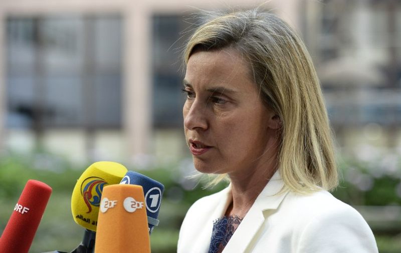 EU's High representative for foreign affairs and security policy Federica Mogherini talks to journalists as she arrives to attend an European Union (EU) emergency summit on the migration crisis with a focus on strengthening external borders, at the EU Headquarters in Brussels, on September 23, 2015, a day after interior ministers agreed a deal on refugee relocation quotas.  AFP PHOTO / THIERRY CHARLIER