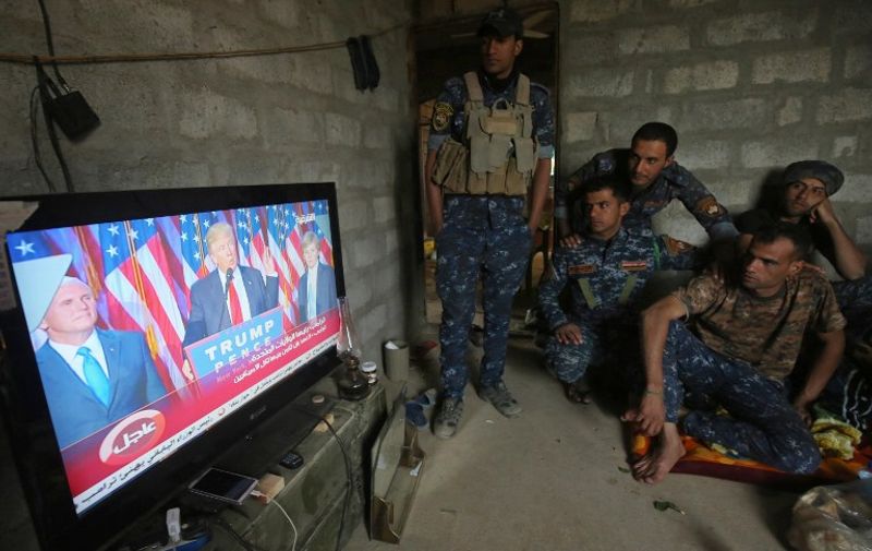 Members of the Iraqi forces watch Donuld Trump giving a speech after he won the US president elections in the village of Arbid on the southern outskirts of Mosul on November 9, 2016, as they rest in a house during the ongoing military operation to retake Mosul from the Islamic State (IS) group. 

Iraqi Prime Minister Haider al-Abadi congratulated Donald Trump on his election as president and said he hoped for continued US and international support in the war against jihadists.

 / AFP PHOTO / AHMAD AL-RUBAYE