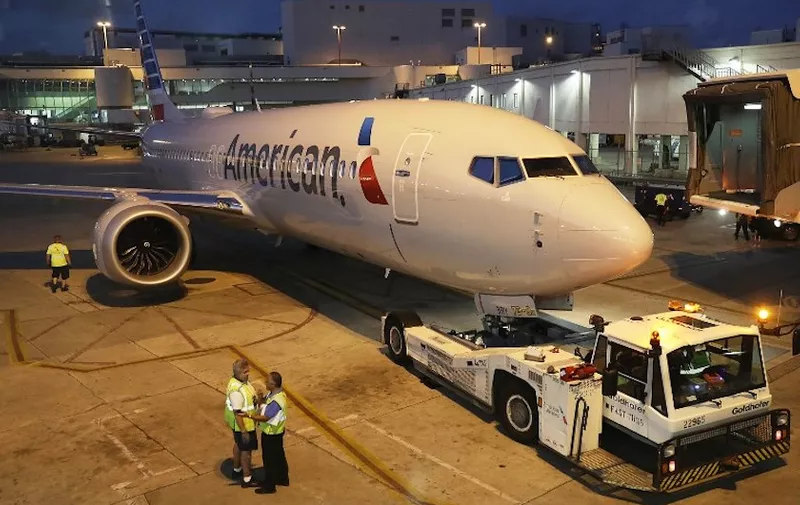 MIAMI, FL - MARCH 13: A grounded American Airlines Boeing 737 Max 8 is towed to another location at Miami International Airport on March 13, 2019 in Miami, Florida. American Airlines is reported to say that it will ground its fleet of 24 Boeing 737 Max planes and it plans to rebook passengers after the Federal Aviation Administration grounded the entire United States Boeing 737 Max fleet.   Joe Raedle/Getty Images/AFP