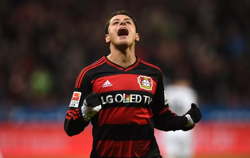 Leverkusen's Mexican striker Javier Hernandez celebrates during the German first division Bundesliga football match Bayer 04 Leverkusen vs Borussia Moenchengladbach in Leverkusen, western Germany, on December 12, 2015. 
AFP PHOTO / PATRIK STOLLARZ

RESTRICTIONS: DURING MATCH TIME: DFL RULES TO LIMIT THE ONLINE USAGE TO 15 PICTURES PER MATCH AND FORBID IMAGE SEQUENCES TO SIMULATE VIDEO. == RESTRICTED TO EDITORIAL USE == FOR FURTHER QUERIES PLEASE CONTACT DFL DIRECTLY AT + 49 69 650050. / AFP / PATRIK STOLLARZ