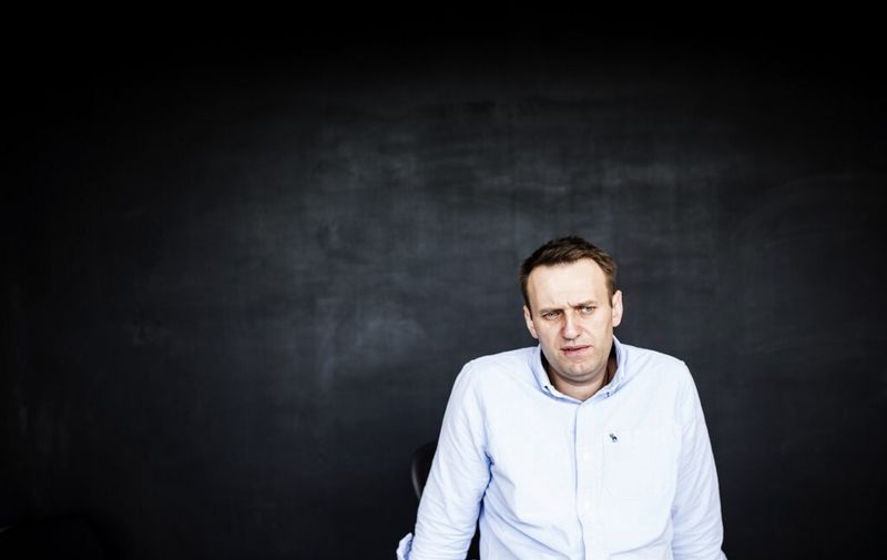 This handout photograph released by 'This Is Navalny Project' shows Russian opposition leader Alexei Navalny in his office in Moscow on July 7, 2017, shortly after being released from jail. - Russian opposition leader Alexei Navalny walked free after 25 days in jail for organising unauthorised protests, his press secretary said. "Today at 9:00 am (0600 GMT) Alexei Navalny was taken from the cell block to the Moscow central district police department and they have now let him out of there," his spokeswoman Kira Yarmysh wrote on Twitter. (Photo by Evgeny FELDMAN / THIS IS NAVALNY PROJECT / AFP) / RESTRICTED TO EDITORIAL USE - MANDATORY CREDIT "AFP PHOTO / THIS IS NAVALNY PROJECT/EVGENY FELDMAN" - NO MARKETING NO ADVERTISING CAMPAIGNS - DISTRIBUTED AS A SERVICE TO CLIENTS