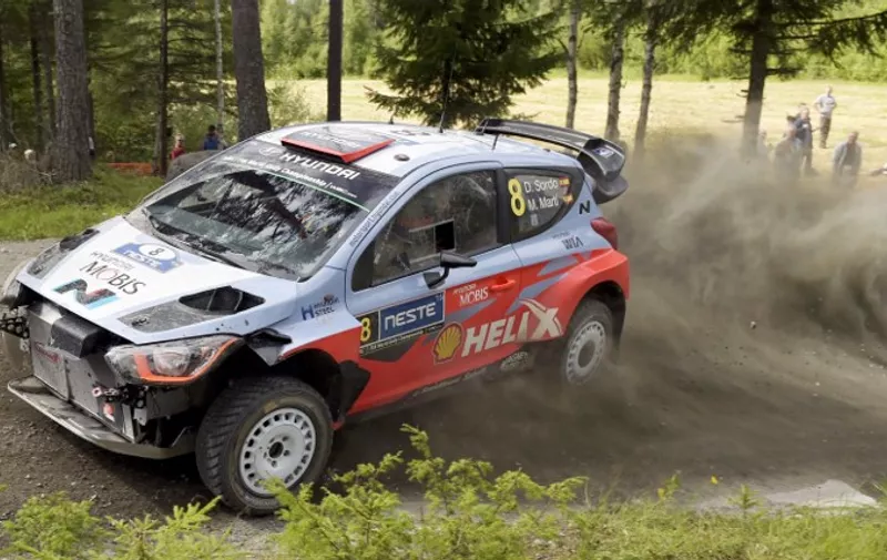 Spanish Hyundai i20 WRC driver Dani Sordo and co-pilot Marc Marti drive during the Moekkiperae special stage of the  2015 FIA World Rally Championship WRC Rally Finland in Jyvaeskylae, Finland on August 1, 2015.  AFP PHOTO / LEHTIKUVA / Vesa Moilanen +++ FINLAND OUT