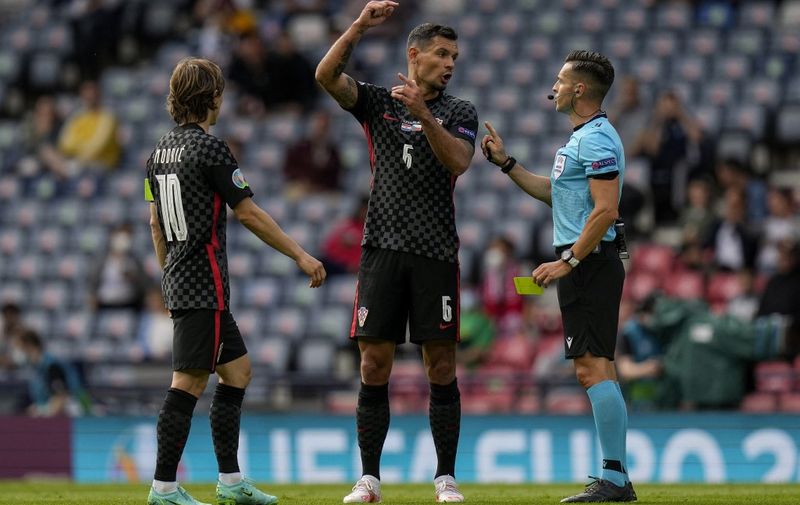Croatia's defender Dejan Lovren (C) talks with Spanish referee Carlos del Cerro Grande during the UEFA EURO 2020 Group D football match between Croatia and Czech Republic at Hampden Park in Glasgow on June 18, 2021. (Photo by Petr David Josek / POOL / AFP)