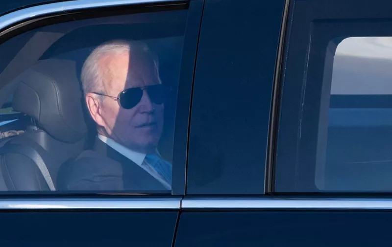 US President Joe Biden sits in a limousine to join the airport after the US-Russia summit in Geneva on June 16, 2021. (Photo by SEBASTIEN BOZON / AFP)