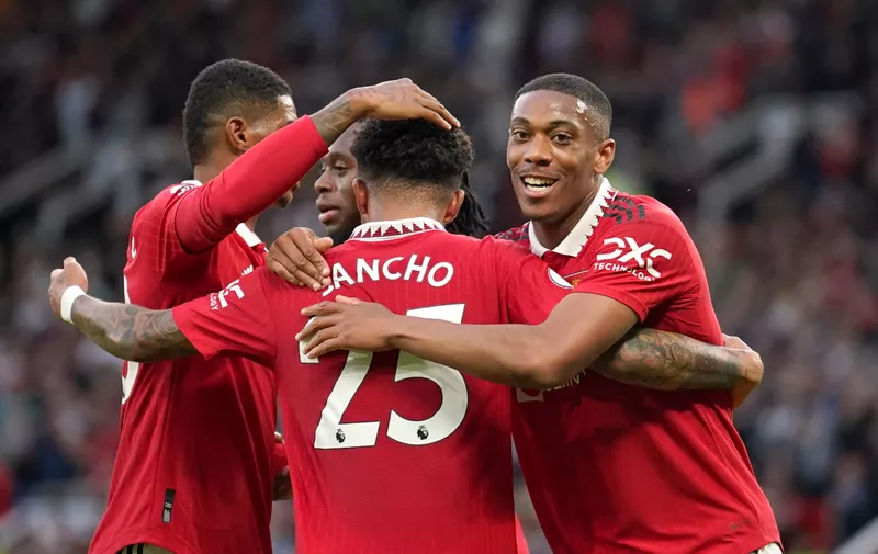Manchester United's Anthony Martial, right, celebrates with teammates after scoring his side's second goal during the English Premier League soccer match between Manchester United and Chelsea at the Old Trafford stadium in Manchester, England, Thursday, May 25, 2023. (AP Photo/Dave Thompson)
