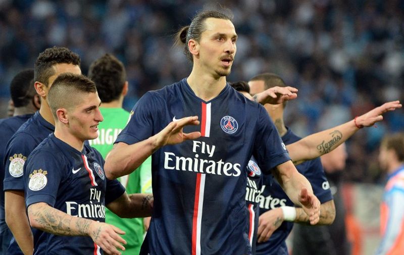 Paris Saint-Germain&#8217;s Swedish midfielder Zlatan Ibrahimovic (C) and Paris Saint-Germain&#8217;s Italian midfielder Marco Verrati (L) react at the end of the French L1 football match between Marseille (OM) and Paris (PSG) on April 5, 2015 at the Velodrome stadium in Marseille, southern France. AFP PHOTO / BORIS HORVAT