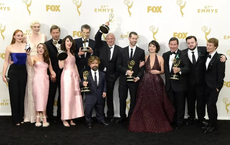 LOS ANGELES, CA - SEPTEMBER 20: Actors Sophie Turner, Gwendoline Christie, Maisie Williams, Nikolaj Coster-Waldau, Carice van Houten, writer David Benioff, actor Peter Dinklage, Conleth Hill, writer D. B. Weiss, Lena Headey, director David Nutter and actors John Bradley-West and Alfie Allen, winners of Outstanding Drama Series for 'Game of Thrones', pose in the press room at the 67th Annual Primetime Emmy Awards at Microsoft Theater on September 20, 2015 in Los Angeles, California.  Kevork Djansezian/Getty Images/AFP