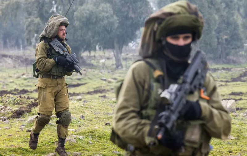 Israeli soldiers from the Golani Brigade take part in a military training exercise in the Israeli-annexed Golan Heights near the border with Syria on January 19, 2015. Iran confirmed today that a general of its elite Revolutionary Guards died in an Israeli strike on Syria that also killed six members of Lebanese militant group Hezbollah.  AFP PHOTO / JACK GUEZ / AFP / JACK GUEZ