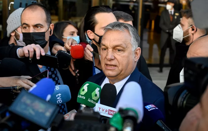 Hungarian Prime Minister Viktor Orban talks to the press on the sidelines of the "Defend Europe" summit, organised by the Spanish far-right party VOX, in Madrid on January 29, 2022. - A dozen far-right and conservative sovereigntist leaders meet in Madrid for a new summit intended to make progress on forming a joint group in the European Parliament. (Photo by OSCAR DEL POZO / AFP)