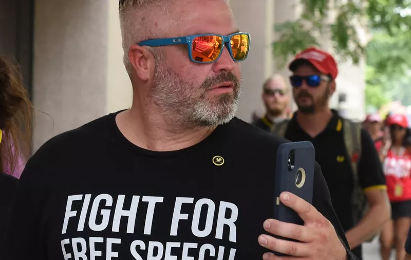 (FILES) Joe Biggs (C) leaves after participating in a "Demand Free Speech" rally on Freedom Plaza on July 6, 2019, in Washington, DC. Biggs, a leader of the Proud Boys militia who called for a "war" to keep Donald Trump president, was sentenced to 17 years in prison on August 31, 2023, one of the longest sentences yet over the January 6, 2021, attack on the US Capitol. (Photo by STEPHANIE KEITH / GETTY IMAGES NORTH AMERICA / AFP)