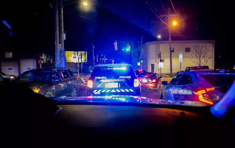 Police cruisers take part in a pursuit as they attempt to catch a man who stole a car and sped away in Chelsea, Massachusetts on May 1, 2021. Chelsea, a 2.2 square-mile (5.7 square km) city, has a population of close to 40,000 people made up of mostly people of Latino or Hispanic origin, 67% according to the US Census Bureau. The Bureau also reports that 18% of the population lives at the poverty line.  The Chelsea Police Department considers itself ahead of many parts of theUS when it comes to community policing and the way it deals with de-escalating domestic and criminal situations. (Photo by Joseph Prezioso / AFP)