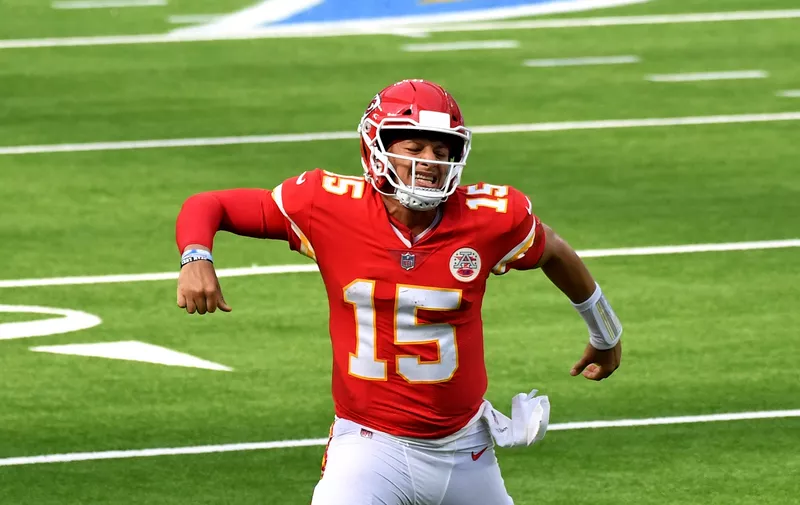 quarterback Patrick Mahomes #15 of the Kansas City Chiefs reacts after throwing a touchdown pass to wide receiver Tyreek Hill (not pictured) against the Los Angeles Chargers in the second half of a NFL football game at SoFi Stadium in Inglewood on Sunday, September 20, 2020. Kansas City Chiefs won 23-20 in overtime. (Keith Birmingham/The Orange County Register via AP)