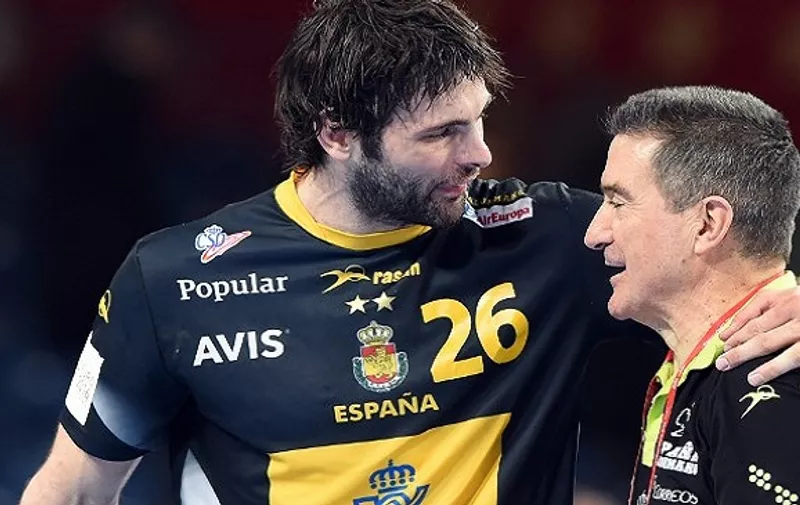Spain's  coach Manuel Cadenas Montanes and Antonio Jesus Garcia react after winning aginst Russia during the Men's 2016 EHF European Handball Championships between Russia and Spain  in Centennial Hall in Wroclaw on January 27, 2016.  / AFP / JANEK SKARZYNSKI