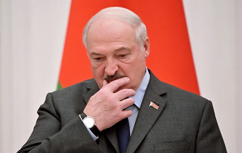 Belarus' President Alexander Lukashenko reacts during a press conference with his Russian counterpart following their talks at the Kremlin in Moscow on February 18, 2022. - Russia's President Vladimir Putin said on February 18, 2022 that the situation in conflict-hit eastern Ukraine was worsening, as the West accuses him of planning an imminent attack on the country. (Photo by Sergei GUNEYEV / Sputnik / AFP)