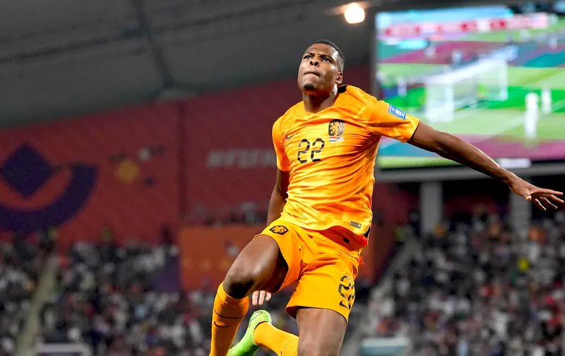 Denzel Dumfries of the Netherlands celebrates scoring his side's 3rd goal during the World Cup round of 16 soccer match between the Netherlands and the United States, at the Khalifa International Stadium in Doha, Qatar, Saturday, Dec. 3, 2022. (AP Photo/Ashley Landis)