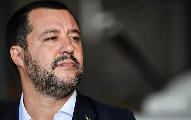 Italyís Interior Minister and deputy PM Matteo Salvini attends a welcomeing ceremony on November 14, 2018 for a group of 51 migrants from Niger, entitled to international protection, upon their arrival at the Mario De Bernardi military airport in Pratica di Mare, south of Rome. (Photo by Alberto PIZZOLI / AFP)
