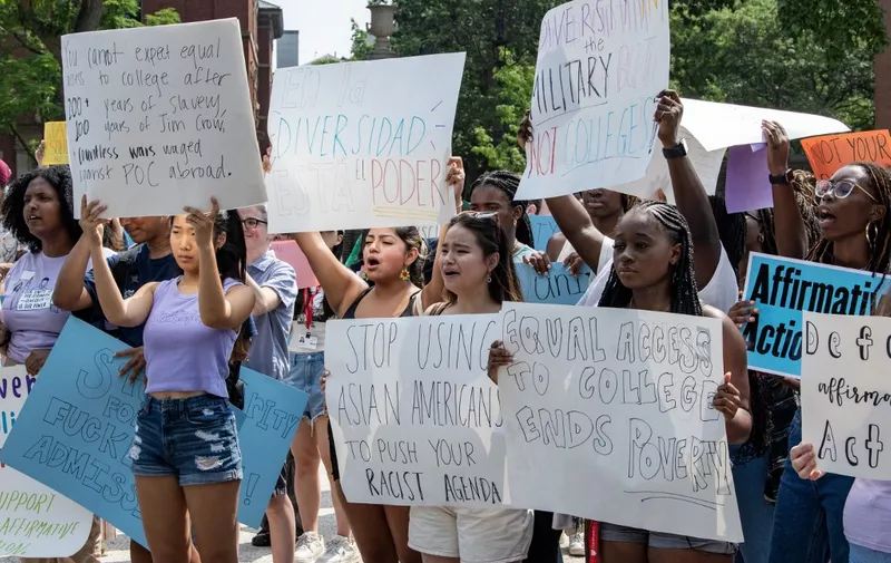 Proponents of affirmative action hold signs during a protest at Harvard University in Cambridge, Massachusetts, on July 1, 2023. The US Supreme Court on June 27 banned the use of race and ethnicity in university admissions, dealing a major blow to a decades-old practice that boosted educational opportunities for African-Americans and other minorities. (Photo by Joseph Prezioso / AFP)