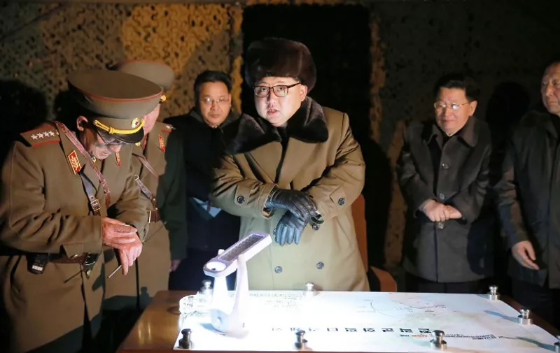 This undated picture released from North Korea's official Korean Central News Agency (KCNA) on March 11, 2016 shows North Korean leader Kim Jong-Un (C) attending a mobile drill for ballistic rocket launch.
North Korean leader Kim Jong-Un has ordered further nuclear tests, state media said on March 11, as military tensions surge on the Korean peninsula with South Korean and US forces engaged in large-scale joint exercises condemned by Pyongyang. / AFP / KCNA / KNS