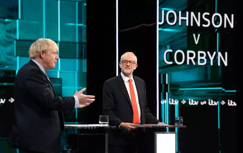 A handout picture taken and released by ITV on November 19, 2019, shows  Britain's Prime Minister Boris Johnson (L) and Britain's Labour Party leader Jeremy Corbyn (R) as they debate on the set of "Johnson v Corbyn: The ITV Debate" in Salford, north-west England. - Britain will go to the polls on December 12, 2019 to vote in a pre-Christmas general election. (Photo by Jonathan HORDLE / various sources / AFP) / RESTRICTED TO EDITORIAL USE - MANDATORY CREDIT "AFP PHOTO / ITV / JONATHAN HORDLE" - NO MARKETING NO ADVERTISING CAMPAIGNS - DISTRIBUTED AS A SERVICE TO CLIENTS  - NO USES AFTER 18TH DECEMBER 2019 --- NO ARCHIVE ---