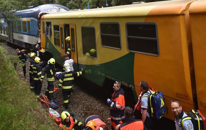 A handout photo released by the firefighters from HZS Karlovarskeho Kraje on July 7, 2020 shows the collision of two trains near the village of Pernink, Czech Republic. - Two people died and dozens were injured on July 7, 2020 when two passenger trains collided near the western Czech spa city of Karlovy Vary, a railway spokeswoman said. (Photo by Handout / HZS KARLOVARSKEHO KRAJE / AFP) / RESTRICTED TO EDITORIAL USE - MANDATORY CREDIT "AFP PHOTO / HZS Karlovarskeho Kraje " - NO MARKETING - NO ADVERTISING CAMPAIGNS - DISTRIBUTED AS A SERVICE TO CLIENTS