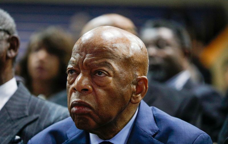 (FILES) In this file photo taken on November 03, 2019  Congressman John Lewis (D-GA) listens to Stevie Wonder speak at the funeral of former U.S. Congressman John Conyers Jr. (D-MI) at Greater Grace Temple on November 4, 2019 in Detroit, Michigan.  John Lewis, the non-violent civil rights warrior who marched with Martin Luther King Jr and nearly died from police beatings before serving for decades as a US congressman, has died at age 80, House colleagues said July 17, 2020. In December 2019, he was diagnosed with pancreatic cancer.,Image: 544414183, License: Rights-managed, Restrictions: , Model Release: no