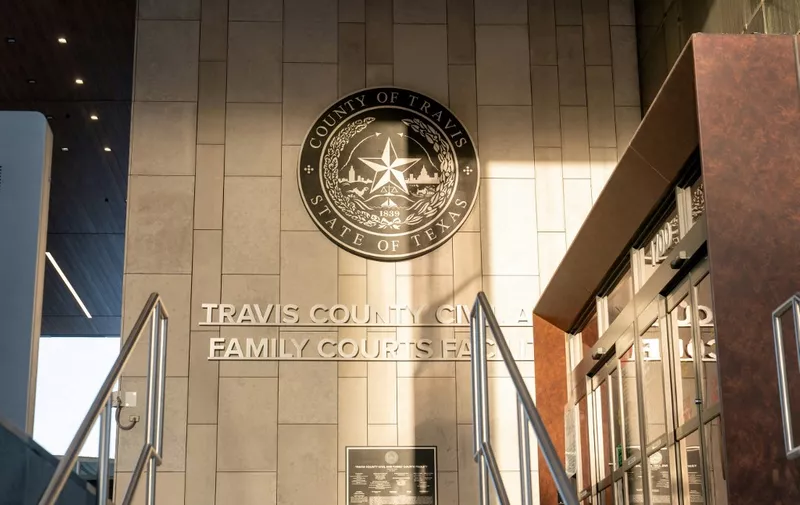 The Travis County 459th District Court is seen prior to an emergency hearing in Cox v Texas, in Austin, Texas, on December 7, 2023. Kate Cox, a 31-year-old mother-of-two from Dallas-Fort Worth, sued the state of Texas on December 5, 2023, in order to get an abortion for a pregnancy that she and her doctors say threatens her life and future fertility. Cox learned last week that her fetus has full trisomy 18, a condition that means her pregnancy may not survive until birth and if it does her baby would be stillborn or live for minutes, hours or days, according to the lawsuit. (Photo by SUZANNE CORDEIRO / AFP)