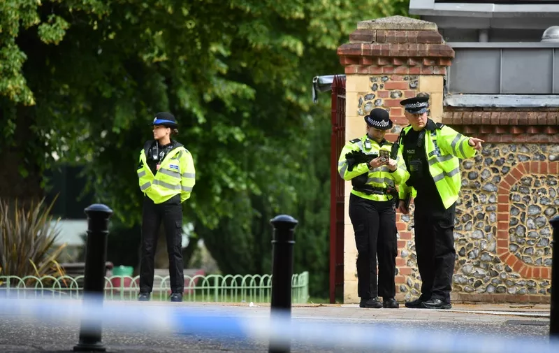 Police officers secure a police cordon near Forbury Gardens park in Reading, west of London, on June 20, 2020 following a stabbing incident the previous day. - British police said Sunday they were keeping an open mind about what prompted a lone suspect to stab three people to death in a park filled with families and friends relaxing in the southern English city of Reading. (Photo by Ben STANSALL / AFP)
