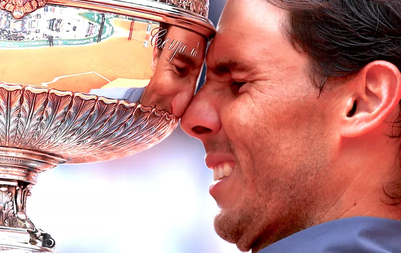 PARIS, FRANCE &#8211; JUNE 09: Rafael Nadal of Spain celebrates with the trophy following the mens singles final against Dominic Thiem of Austria during Day fifteen of the 2019 French Open at Roland Garros on June 09, 2019 in Paris, France. (Photo by Clive Brunskill/Getty Images)