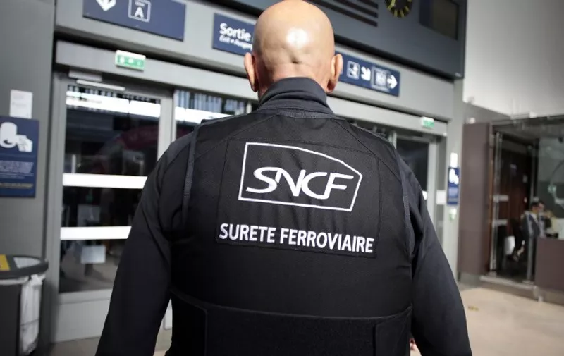 An officer of the French rail network (SNCF) security patrols the Caen railway station on October 21, 2014. AFP PHOTO/CHARLY TRIBALLEAU