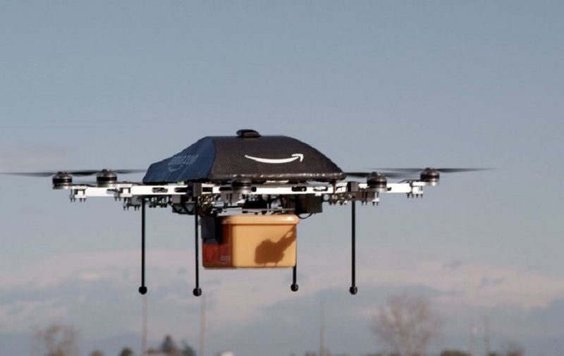This undated handout photo released by Amazon on December 1, 2013 shows a flying "octocopter" mini-drone that would be used to fly small packages to consumers. Amazon CEO Jeff Bezos revealed on December 1 that his company was looking to the future with plans to use mini-drones to deliver small packages. AFP PHOTO / AMAZON  --- EDITORS NOTE --- RESTRICTED TO EDITORIAL USE - MANDATORY CREDIT "AFP PHOTO / AMAZON " - NO MARKETING NO ADVERTISING CAMPAIGNS - DISTRIBUTED AS A SERVICE TO CLIENTS / AFP PHOTO / AMAZON / AMAZON