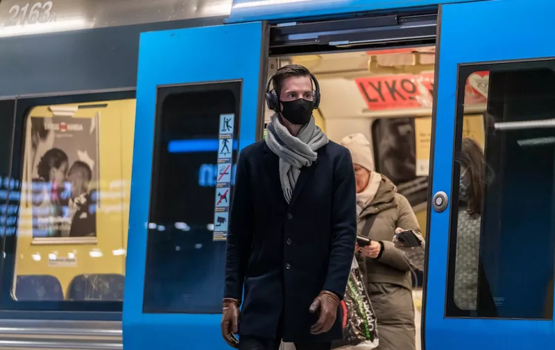 (210210) -- STOCKHOLM, Feb. 10, 2021 (Xinhua) -- A passenger wearing a face mask gets off a subway train in Stockholm, Sweden, on Feb. 10, 2021. The number of Sweden's confirmed coronavirus cases exceeded 600,000 on Wednesday, the country's Public Health Agency said. Meanwhile, the country continues to battle the new, more contagious COVID-19 strain.,Image: 590199144, License: Rights-managed, Restrictions: , Model Release: no, Credit line: Profimedia