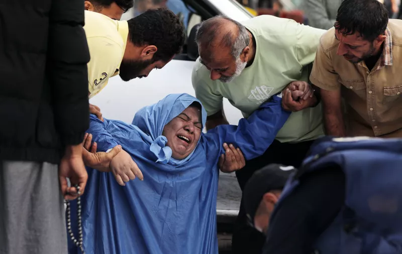 A family member reacts as Palestinian cameraman Mohammed Alaloul (bottom) covers the body of a relative killed in an Israeli strike on the Al-Maghazi refugee camp in Deir Balah in the central Gaza Strip, in front of al-Quds hospital in the same city on November 5, 2023. Alaloul, working for the Turkish Anadolu Agency, told AFP his 13-year-old son, Ahmed, and his four-year-old son, Qais, were killed in the bombing, along with his brother. The Hamas-run health ministry said, Israeli bombing of Al-Maghazi refugee camp killed 45 people, with an eyewitness reporting children dead and homes smashed.
Hamas Israel Conflict, Gaza, Palestine - 05 Nov 2023,Image: 819919984, License: Rights-managed, Restrictions: , Model Release: no