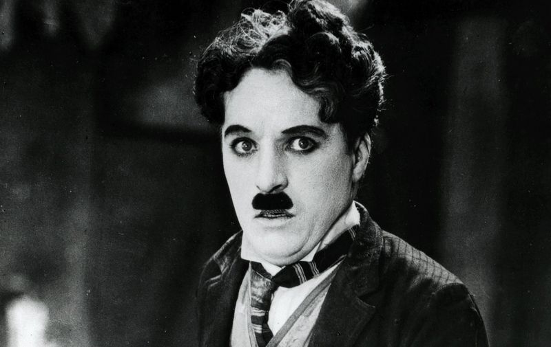 Film actor and director Charlie Chaplin (1889-1977), film star and director, seen here in his &#8216;little tramp&#8217; costume, probably in a still from his 1925 film, The Gold Rush. Date: 1920s