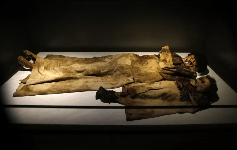 A picture taken on October 13, 2016, shows naturaly preserved mummies, found in the caves of Qadisha valley in the Lebanese mountains and dating back to 1283 A.D., on display in the newly inaugurated basement section of Beirut's National Museum. 
The National Museum of Beirut has a collection of 31 anthropoid sacrophagi, the most important single collection of this type in a museum today. These sacrophagi were built in Sidon workshops between the 6th and the 4th century B.C. / AFP PHOTO / JOSEPH EID / RESTRICTED TO EDITORIAL USE / COURTESY OF BEIRUT NATIONAL MUSEUM
