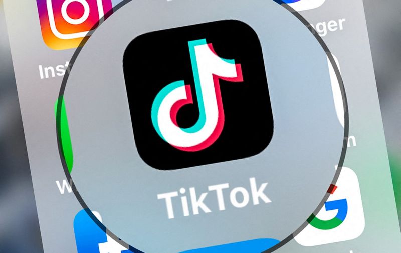 (FILES) This file photo taken on March 24, 2022, shows the logo of networking application TikToK displayed on a tablet in Lille, northern France. - The Canadian government on February 27, 2023, banned TikTok from all of its phones and other devices, citing concerns about data protection. TikTok, whose parent company ByteDance is Chinese, has faced increasing Western scrutiny in recent months over fears about how much access Beijing has to user data. (Photo by DENIS CHARLET / AFP)