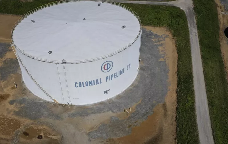 WOODBINE, MD - MAY 13: In an aerial view, fuel holding tanks are seen at Colonial Pipeline's Dorsey Junction Station on May 13, 2021 in Washington, DC. The Colonial Pipeline has returned to operations following a cyberattack that disrupted gas supply for the eastern U.S. for days.   Drew Angerer/Getty Images/AFP (Photo by Drew Angerer / GETTY IMAGES NORTH AMERICA / Getty Images via AFP)